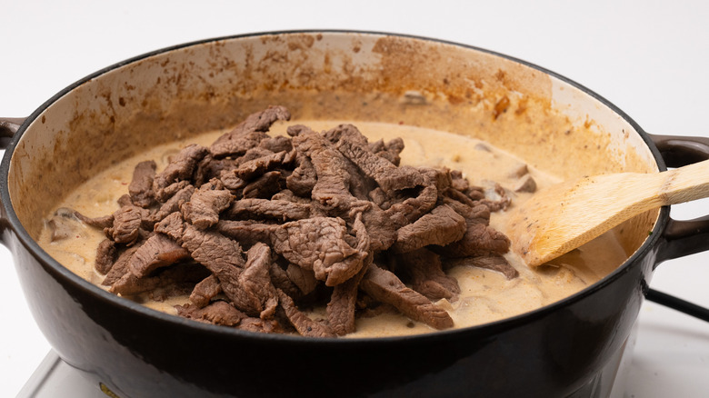 Adding beef to stroganoff