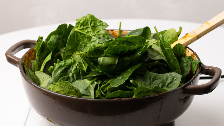 Spinach wilting in a pan