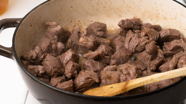 Browning lamb in a pan