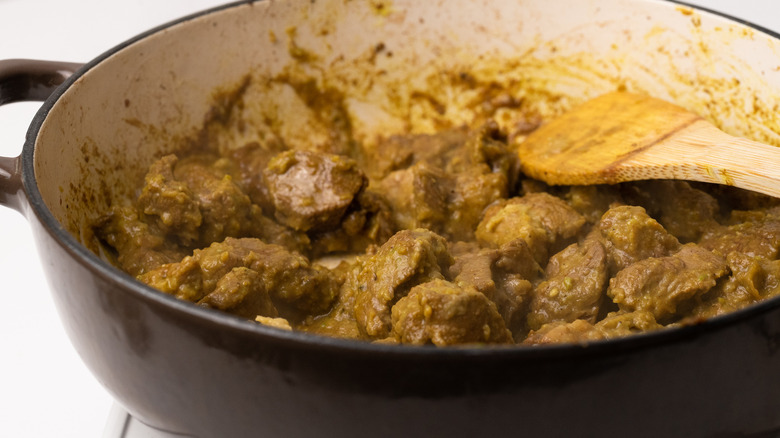 Lamb cooking in curry paste