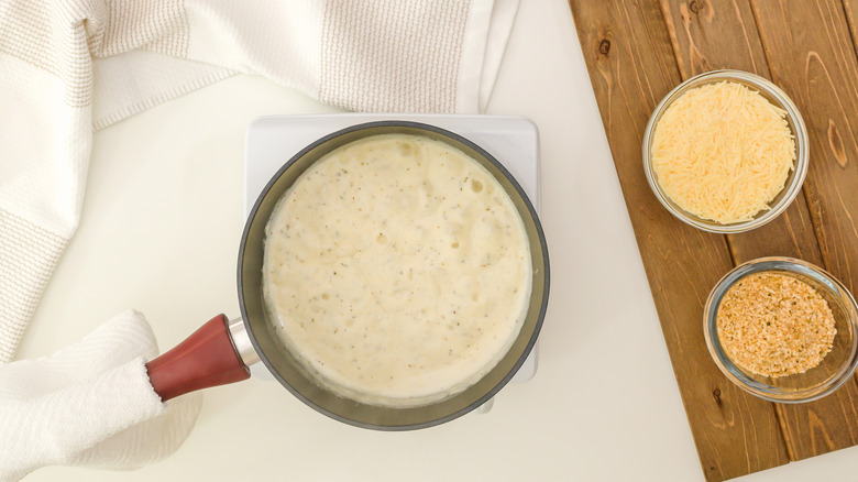 Alfredo sauce in pan