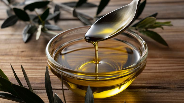 oil pouring into a dish