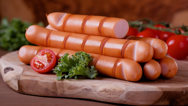 sliced franks on a board