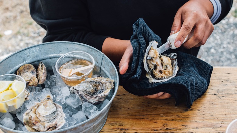 Oyster being shucked