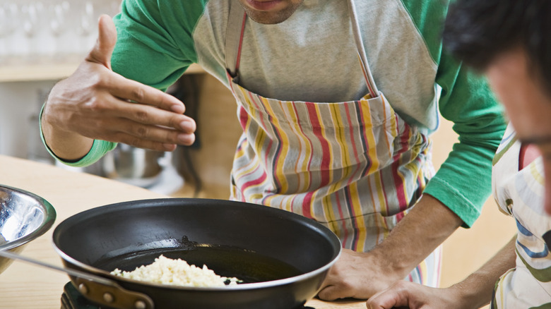 Man cooking garlic