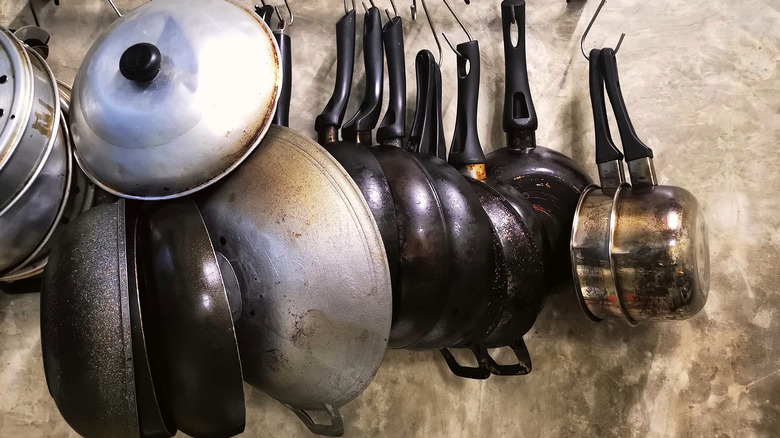 multiple pans and woks