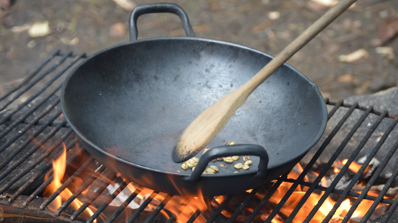 wok over fire and grate