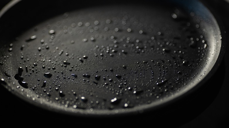 beads of water on a cast iron skillet