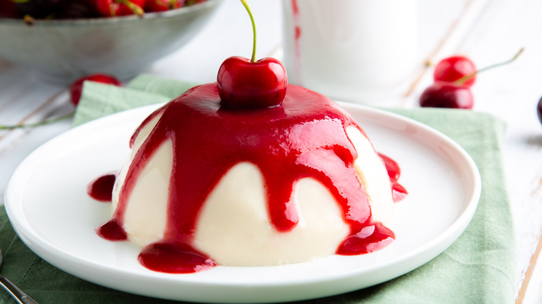 panna cotta covered in red cherry coulis