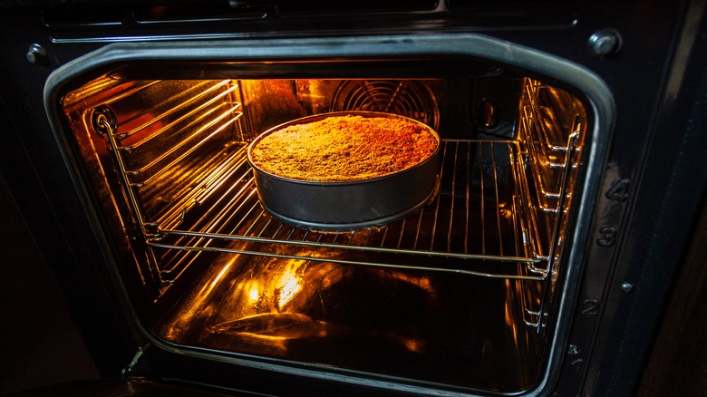 cake baking in open oven