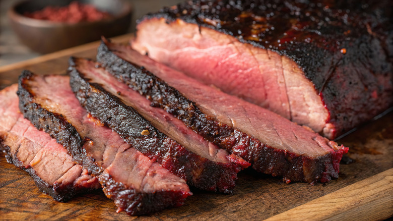 Slices of brisket displayed on a wooden surface