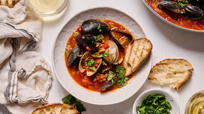 Bowl of clams and mussels in broth