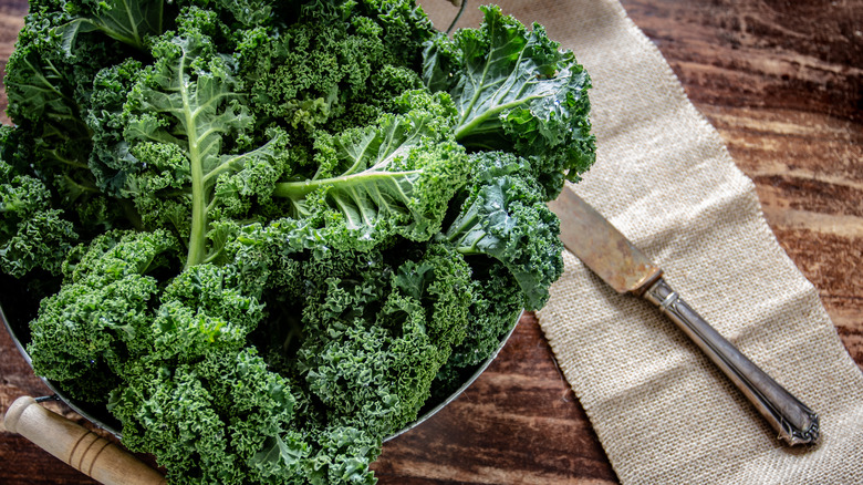 Kale leaves with knife