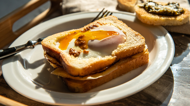 egg in a hole on a white plate