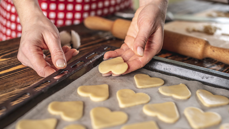 Placing cookies on parchment lined sheet