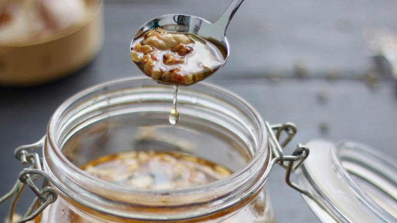 A jar containing garlic oil