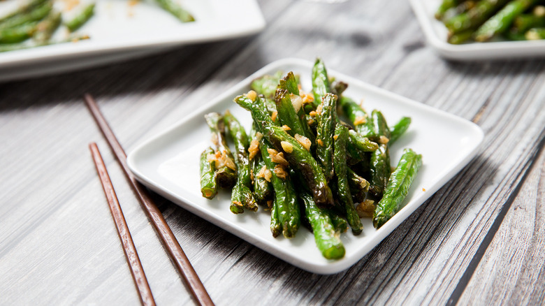 green beans on white dish