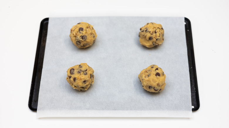 Cookie dough balls on a baking sheet