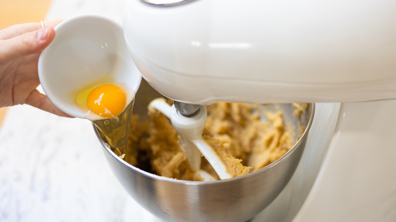 Cookie dough being mixed in a stand mixer