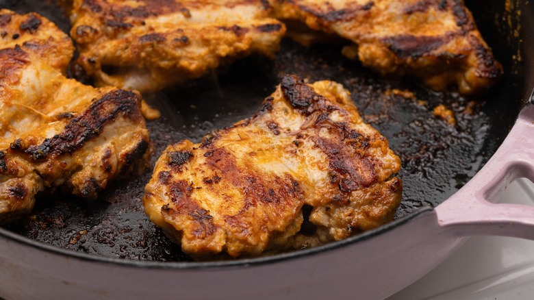 Chicken frying in a pan