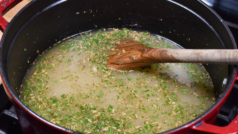 soup pot with dried and fresh herbs