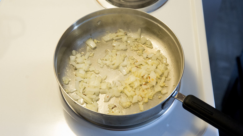 onion sauteing in stovetop pan