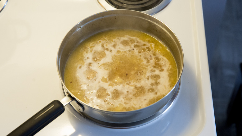 wine boiling in saute pan