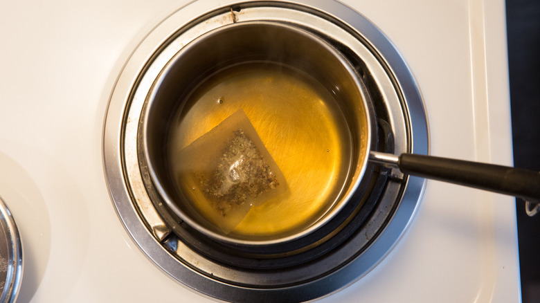 teabag steeping in small pot