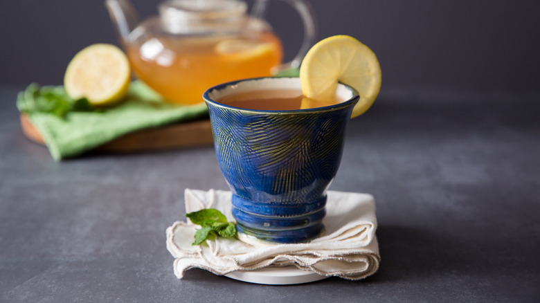 lemon-garnished tea on table