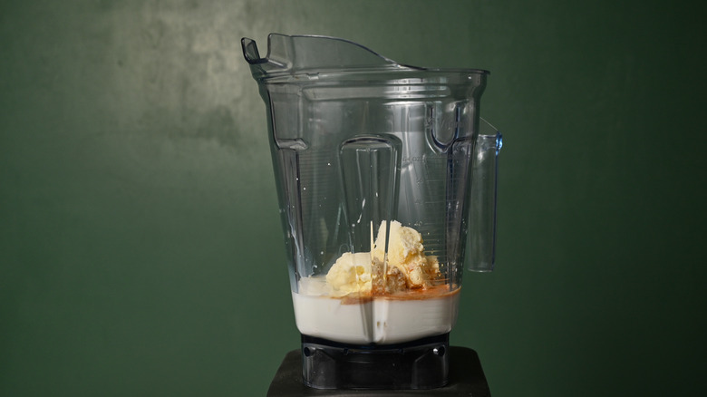 ice cream and milk in a blender