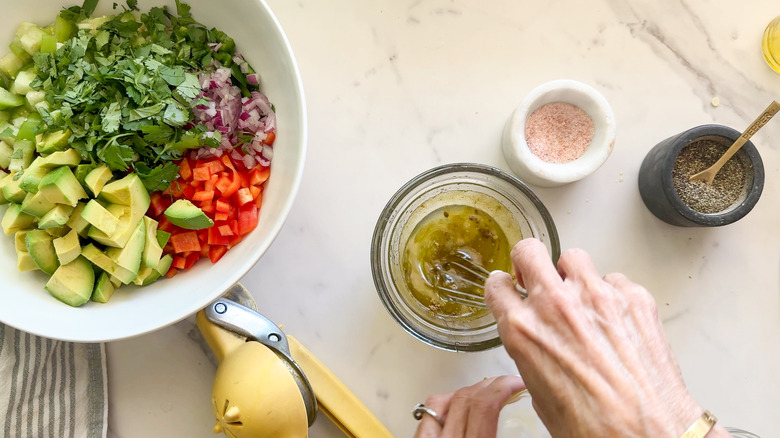 hand whisking dressing in bowl