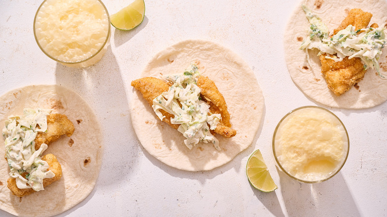 cornmeal crusted catfish tacos on table