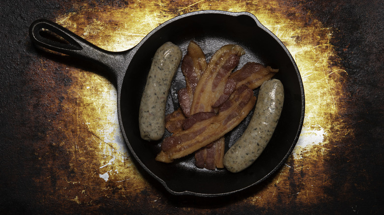 bacon and sausage in a skillet