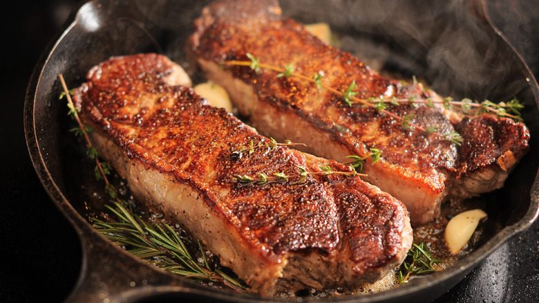 seared strip loins in pan