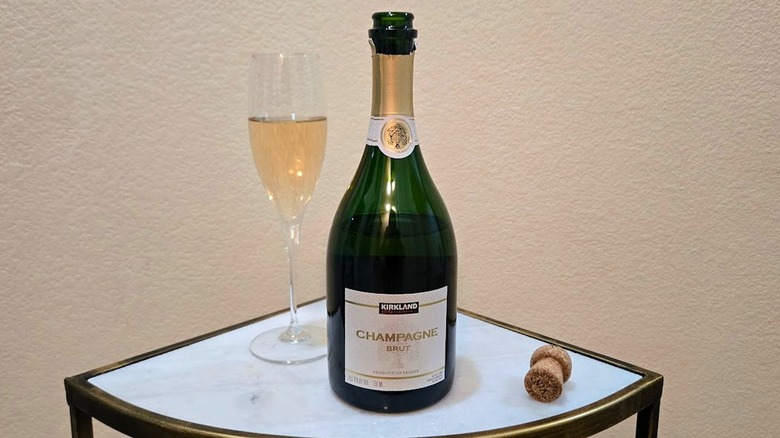 Bottle and glass of Kirkland Signature Champagne