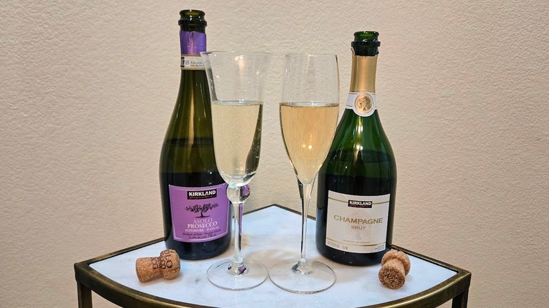 Bottle of Kirkland Signature Prosecco and Champagne with glasses