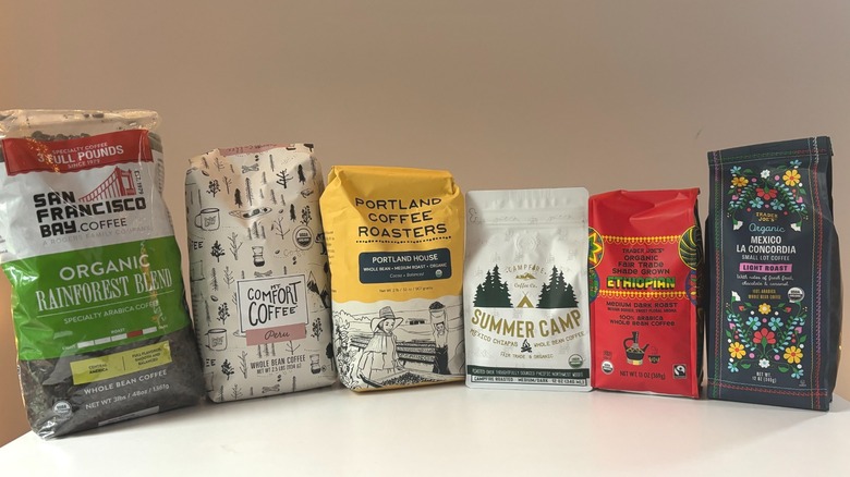 Assortment of bean coffee bags on table