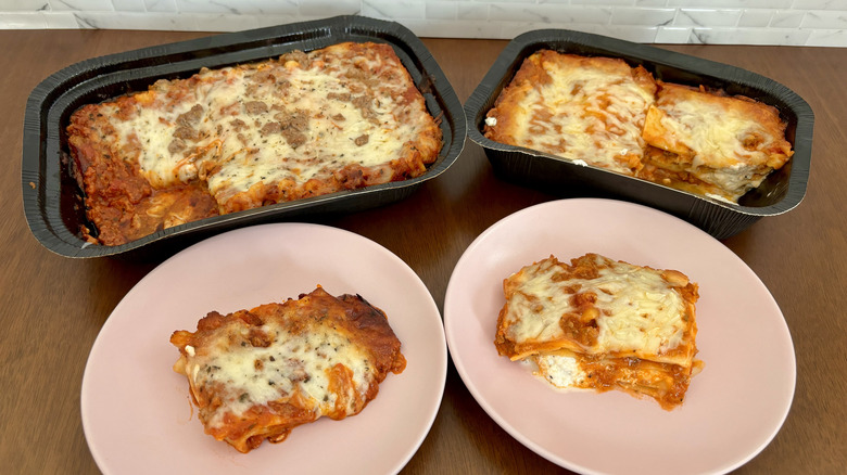 two lasagnas with slices on plates