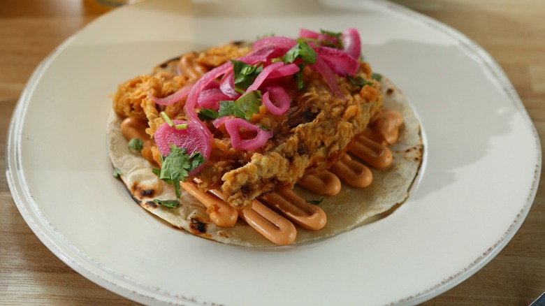 Tempura shrimp taco on a plate