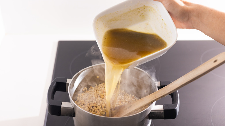 Stock is added to couscous 