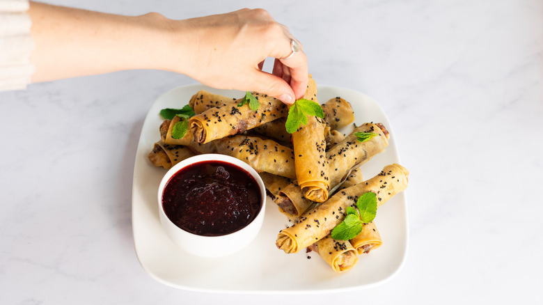 mint leaves on cranberry feta filo cigars 