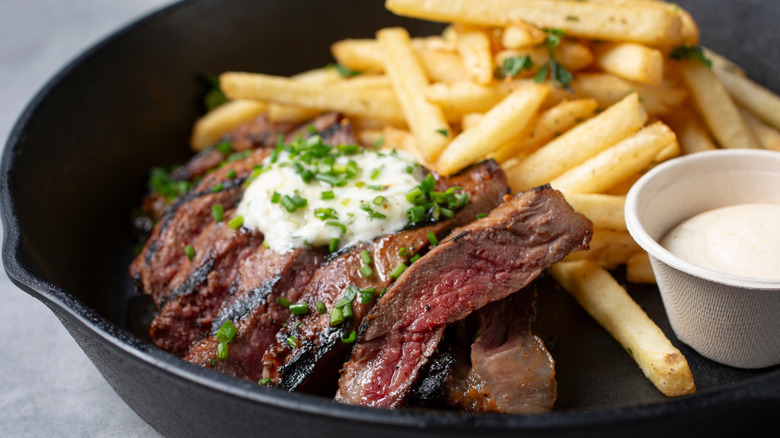 A skillet of steak frites