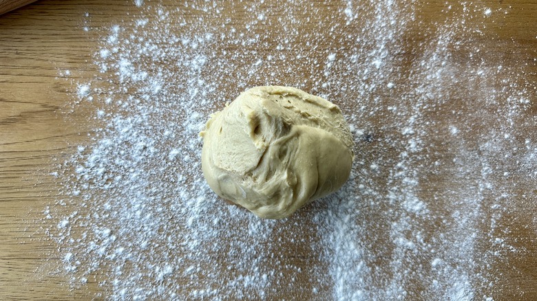 dough ball on floured surface