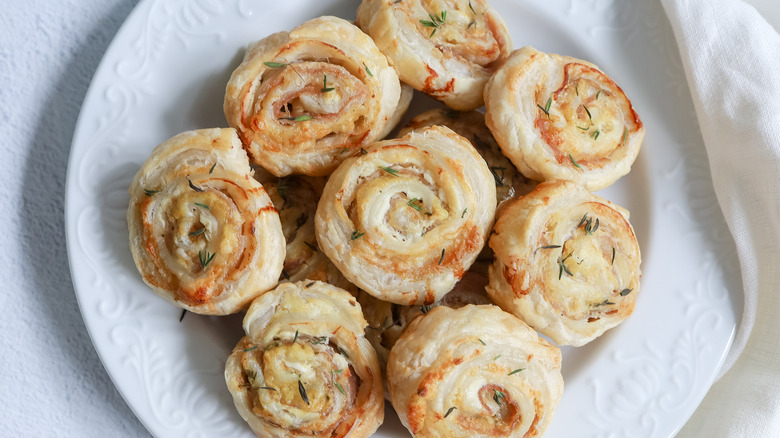 plate with cheese prosciutto pinwheels