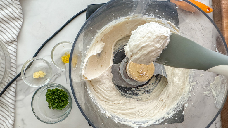 spoon holding blended cheese