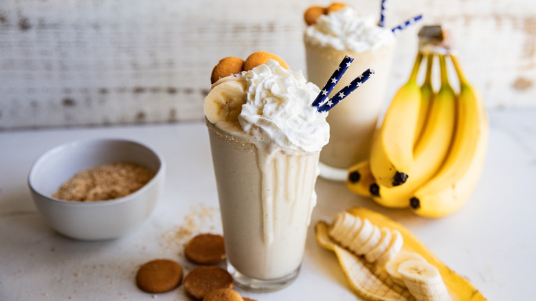 Glass of cold banana pudding milkshake