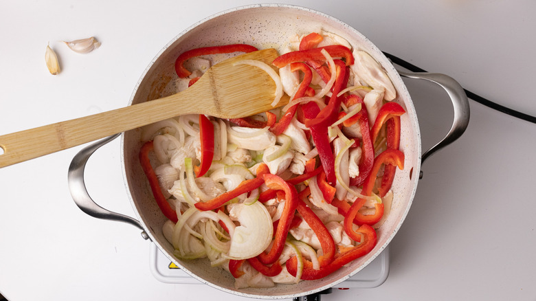 vegetables and chicken in pan 