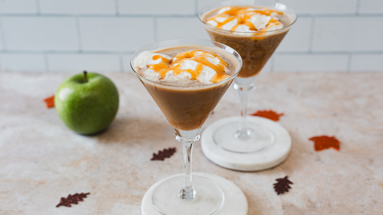 Two caramel apple martini glasses