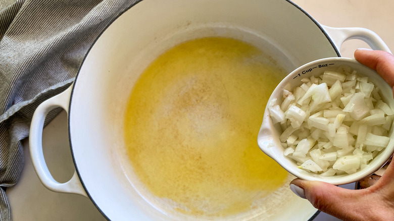 adding onions to pot