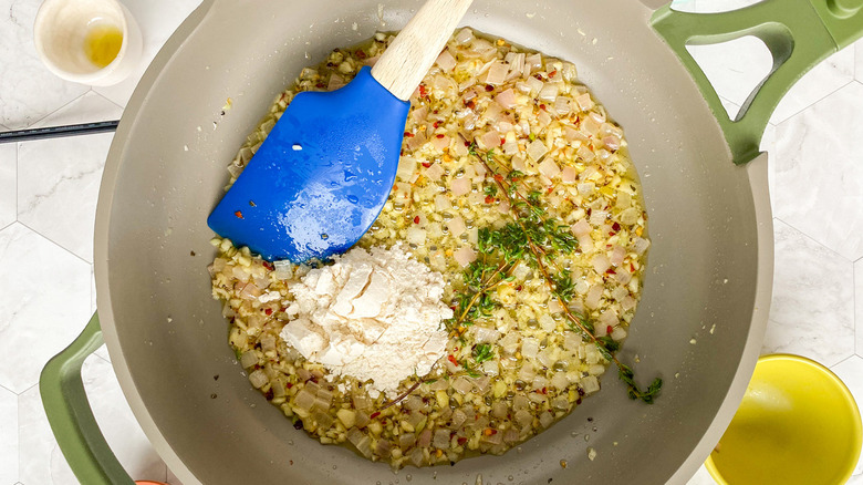 onion and flour in pan